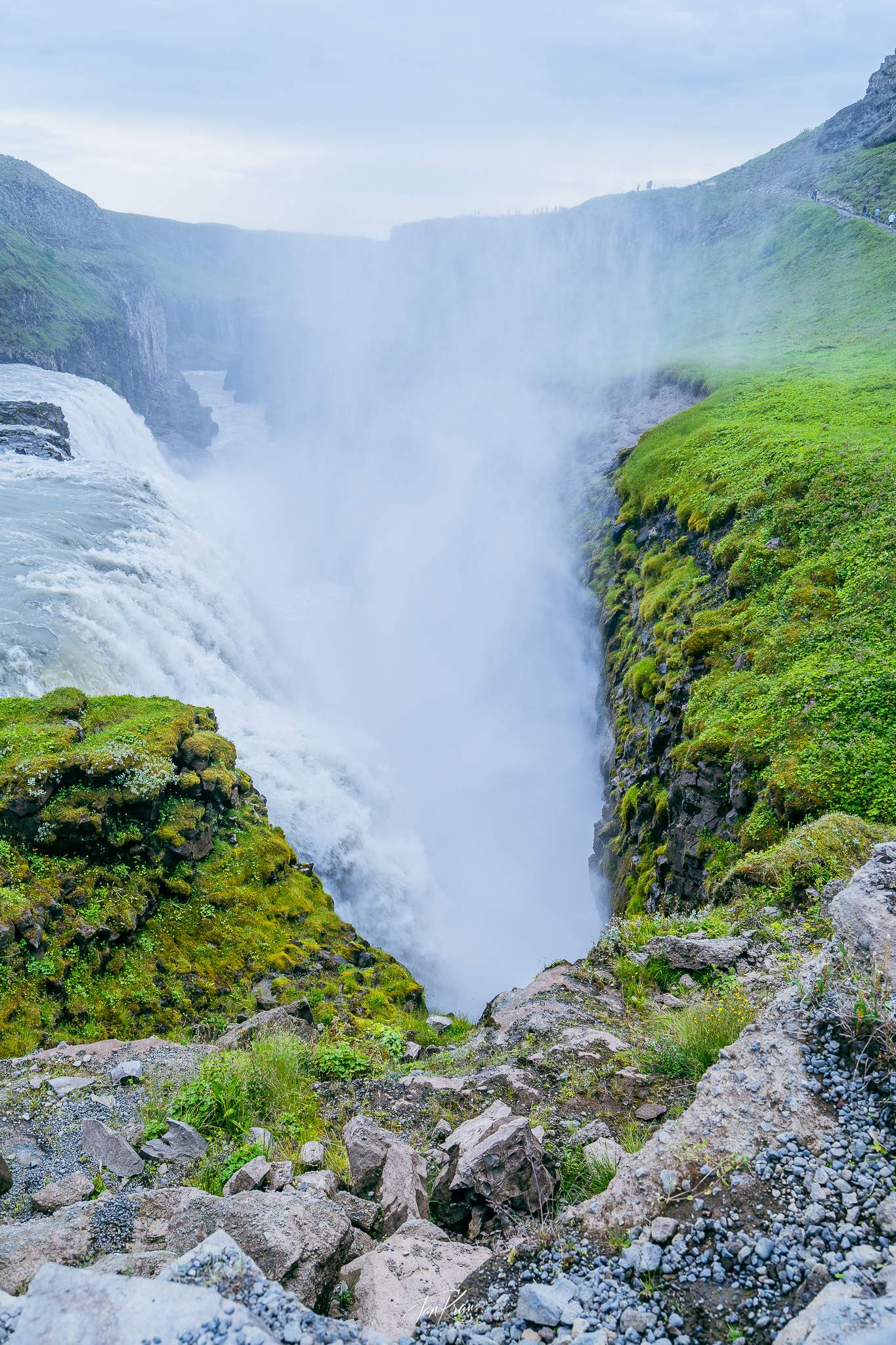 Hypnotising flow of water falling into a narrow crevice at Gullfoss Waterfall, Iceland