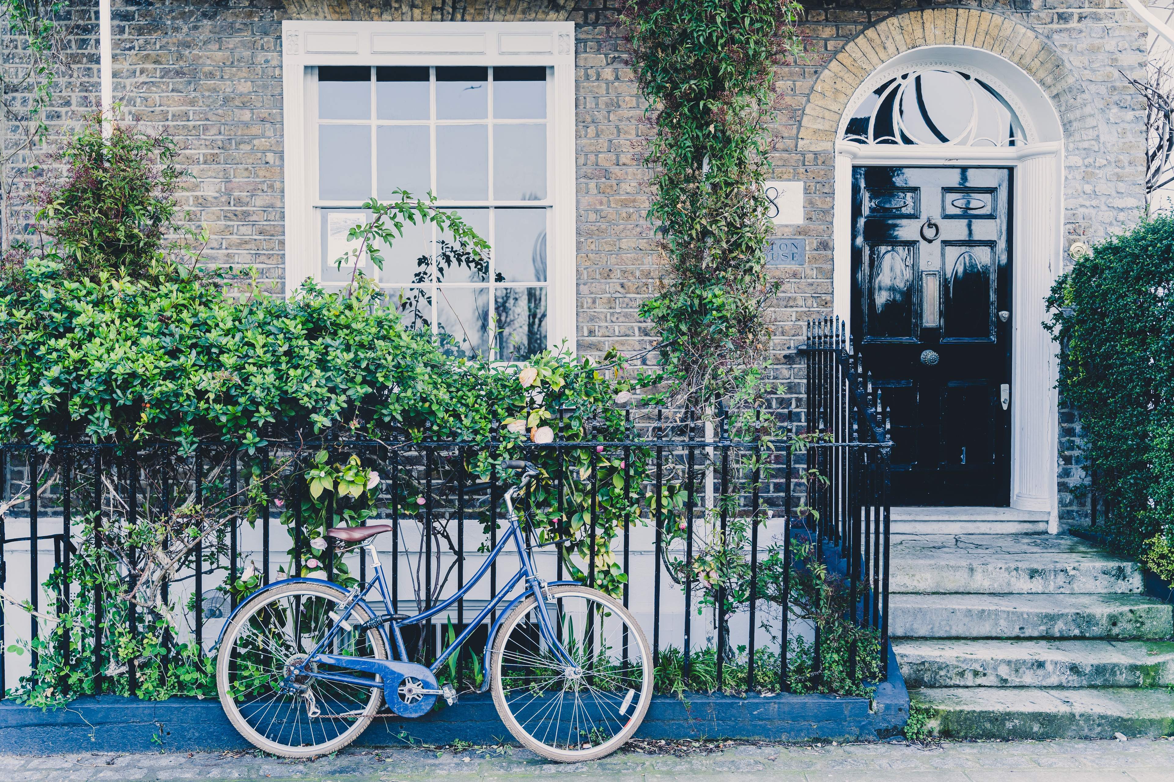 A beautiful house front and a parked bicycle in Hammersmith, London, UK