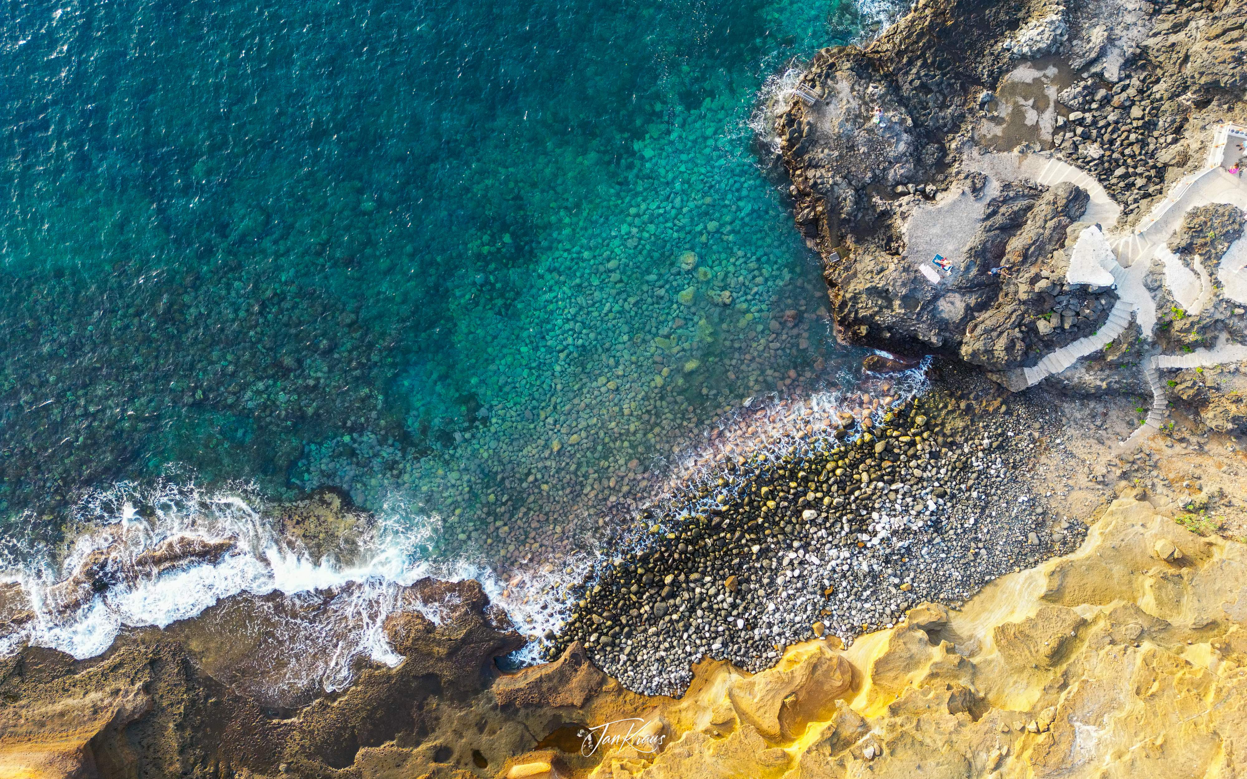 An aerial shot of the rocky beach and the ocean, Montaña Amarilla, Tenerife, Canary Islands, Spain